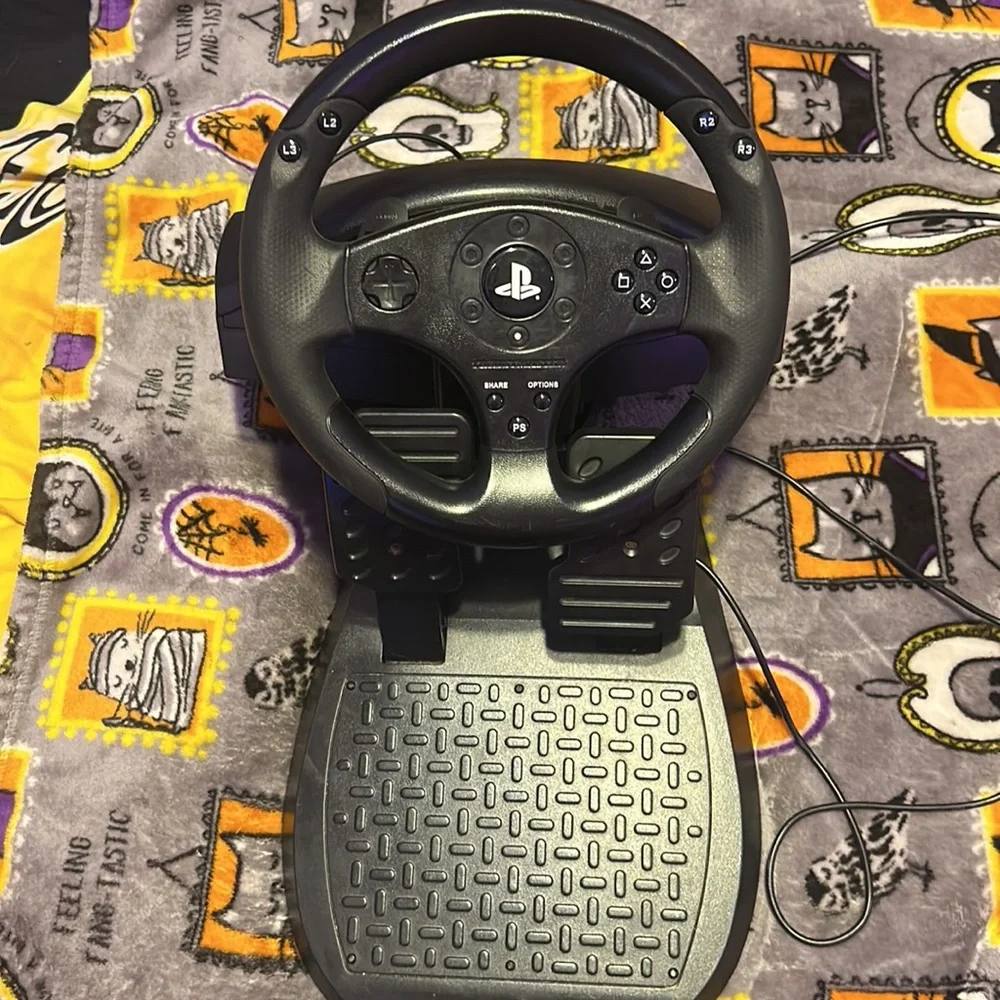 Thrustmaster t80 racing wheel set for PlayStations and can work on pc with code